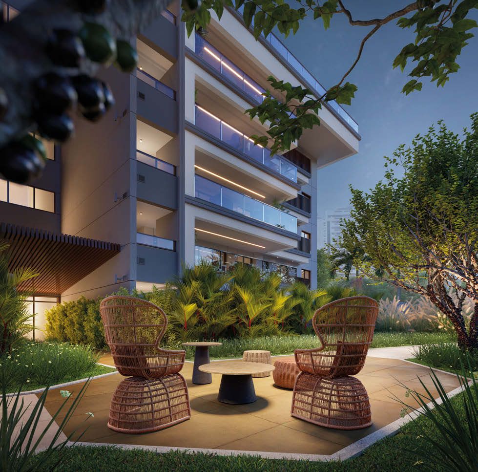 Praça de acesso ao edifício Ischia do Gaea Home Resort com poltronas e jardim iluminado